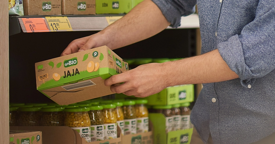 A person taking a box of Bio eggs from a shelf (photo)